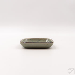 Glazed ceramic puffer-fish serving dish with rounded edges, side view