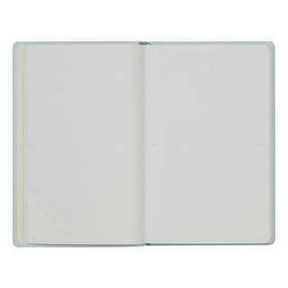 An open notebook with blank, light-colored dot grid pages and a pale mint green cover, shown against a plain white background.