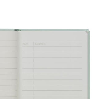 An open lined notebook with blank page and contents columns