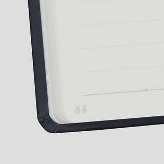 Close-up of a notebook with page number feature