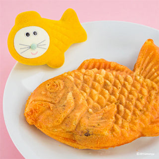 Taiyaki with fish shaped figure on a pink background