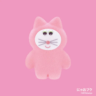 Pink plush toy with a cartoon face on a pink background