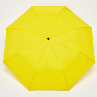 Yellow umbrella on a white background