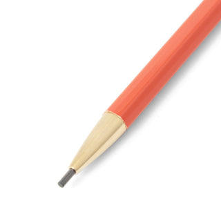Close-up of orange pencil with lead on a white background