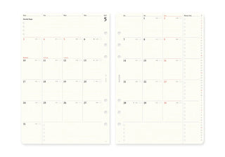 Two cream-colored monthly calendar inserts with pre-drilled holes, displayed side-by-side.