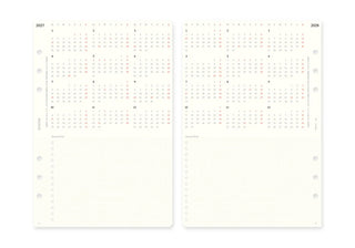 Two cream-colored planner inserts displaying 2027 and 2028 calendar grids with monthly layouts and blank writing space below.