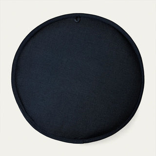 Black circular seat cushion on a white background