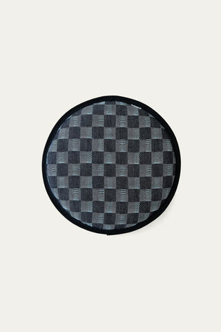 Round checkered seat pad on a white background