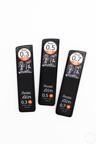 Three black Pentel Ain mechanical pencils with different lead sizes on a white background