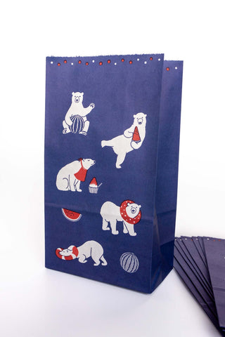 Blue paper bag with white polar bear illustrations on a white background