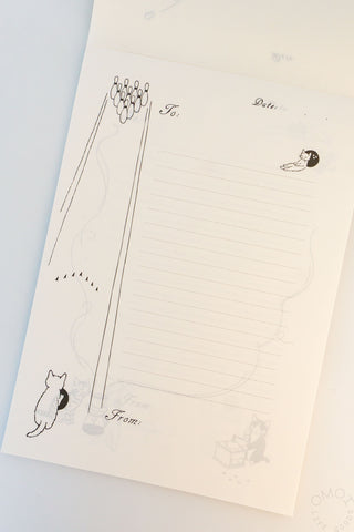 Memo pad page with illustration of a cat bowling