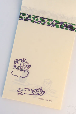 Beige paper bag with purple illustrations of a cat and a cloud on a white background