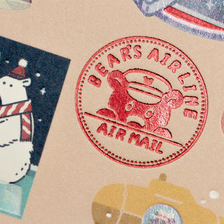 Red 'Bear's Airline Airmail' stamp on a textured surface with cartoon bear and airplane design.