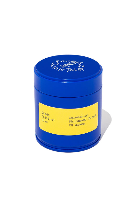 Blue container with a yellow label with rocky's matcha branding on a white background