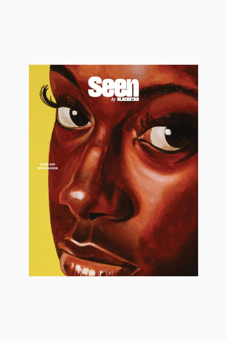 Book cover with illustrated face and 'Seen' text on a yellow and white background