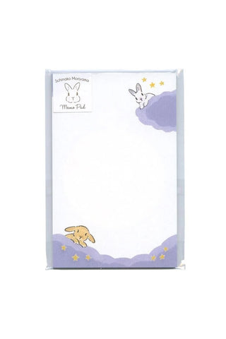 Notepad with cartoon rabbits on clouds on a white background