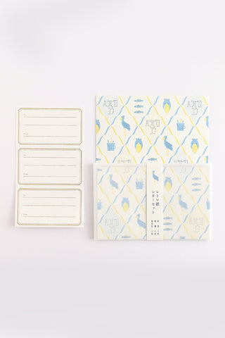 Letter set with shoebill pattern next to letter seals