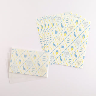 Letter set with shoebill pattern next to envelopes