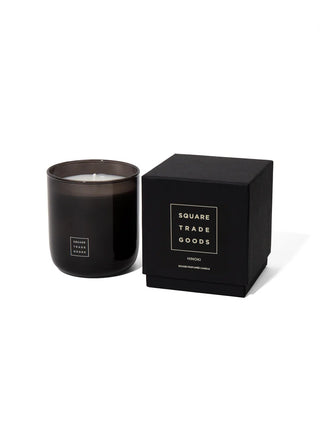Black candle in a matching box with 'Square Trade Goods' branding on a white background