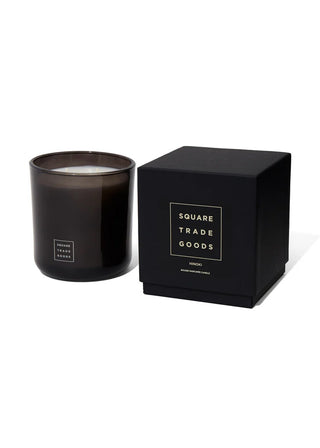 Black candle in a matching box with 'Square Trade Goods' branding on a white background
