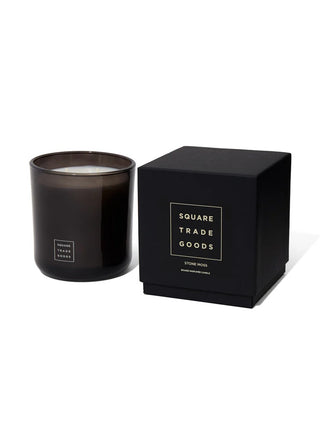 Black candle in a matching black box with 'Square Trade Goods' branding on a white background