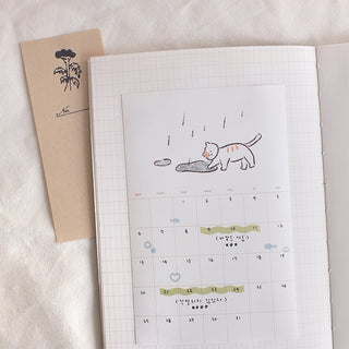Cat monthly planner sticker sheet with numbered grid and small cat icons
