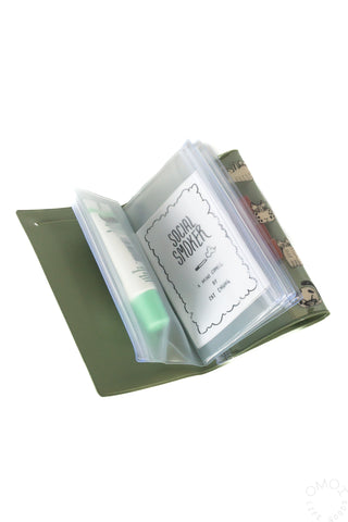 Opened Green cat design 5 pocket pouch with zine inside pocket on a white background