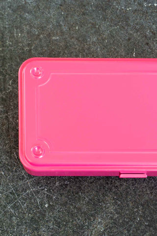 Pink toolbox on a dark textured surface