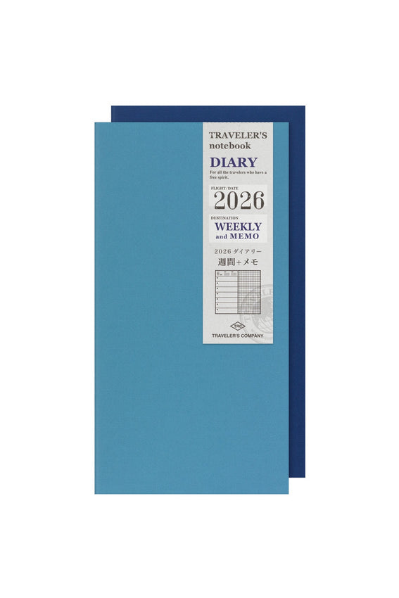 Blue diary with a label indicating 'Traveler's 2026 Weekly and Memo' on a white background