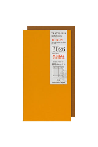 Orange notebook with a label indicating '2026 Weekly Vertical' on a white background