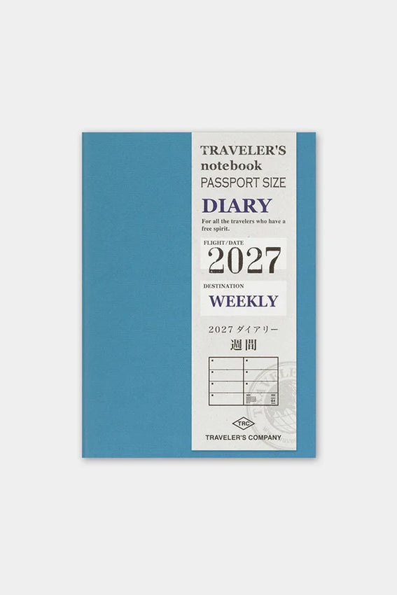 2027 passport weekly planner, blue cover with Traveler's Diary title and 2027 badge