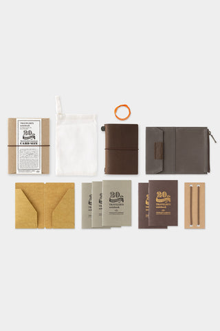 Collection of leather wallet and stationery items of a box set on a white background