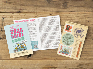 Traveler's Company 2026 Guidebook on a wooden surface