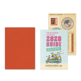 Traveler's notebook with a 2026 guidebook on a white background.