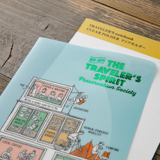 File folder with illustrated covers on a wooden surface