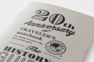 20th Anniversary of Traveler's book with text and logo on a white background