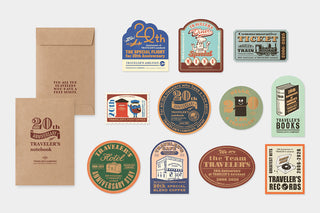 Collection of travel-themed stationery on a white background.