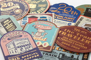 Collection of Traveler's Company notebook stickers with various designs and text.