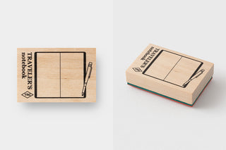 wooden stamps with illustrations of notebooks and pens on a white background