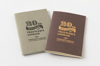 Two '20th Anniversary Traveler's notebook' notebooks on a white background