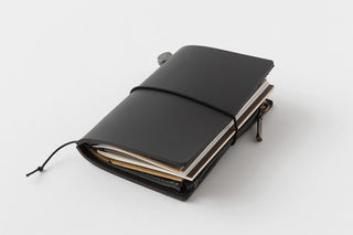 Black leather notebook on a white background