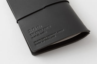 Black leather wallet with embossed text on a white background