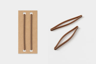 Brown rubber bands on a white background