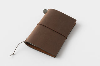 Brown leather notebook on a white background
