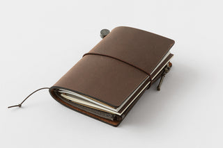 Brown leather notebook on a white background