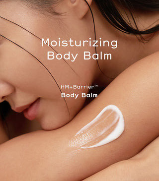 White moisturizing body balm applied on shoulder and neck near face