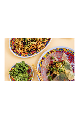 Dishes with salad, noodles on a white background