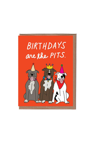 Card with three cartoon dogs wearing party hats and the text 'Birthdays are the pits' on an orange background.