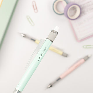 Light blue pencil with white cap on a light gray background with stationery items.
