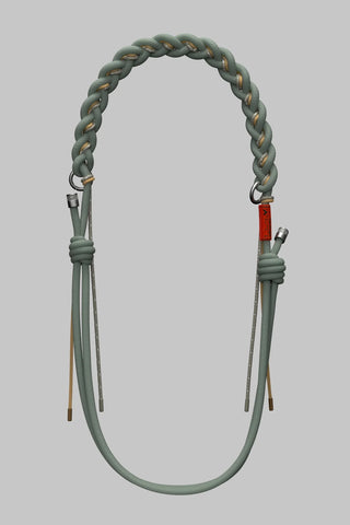 A braided rope bag strap with a thick braided top loop, two knotted lower sections, and small metal hardware, on a light gray background.